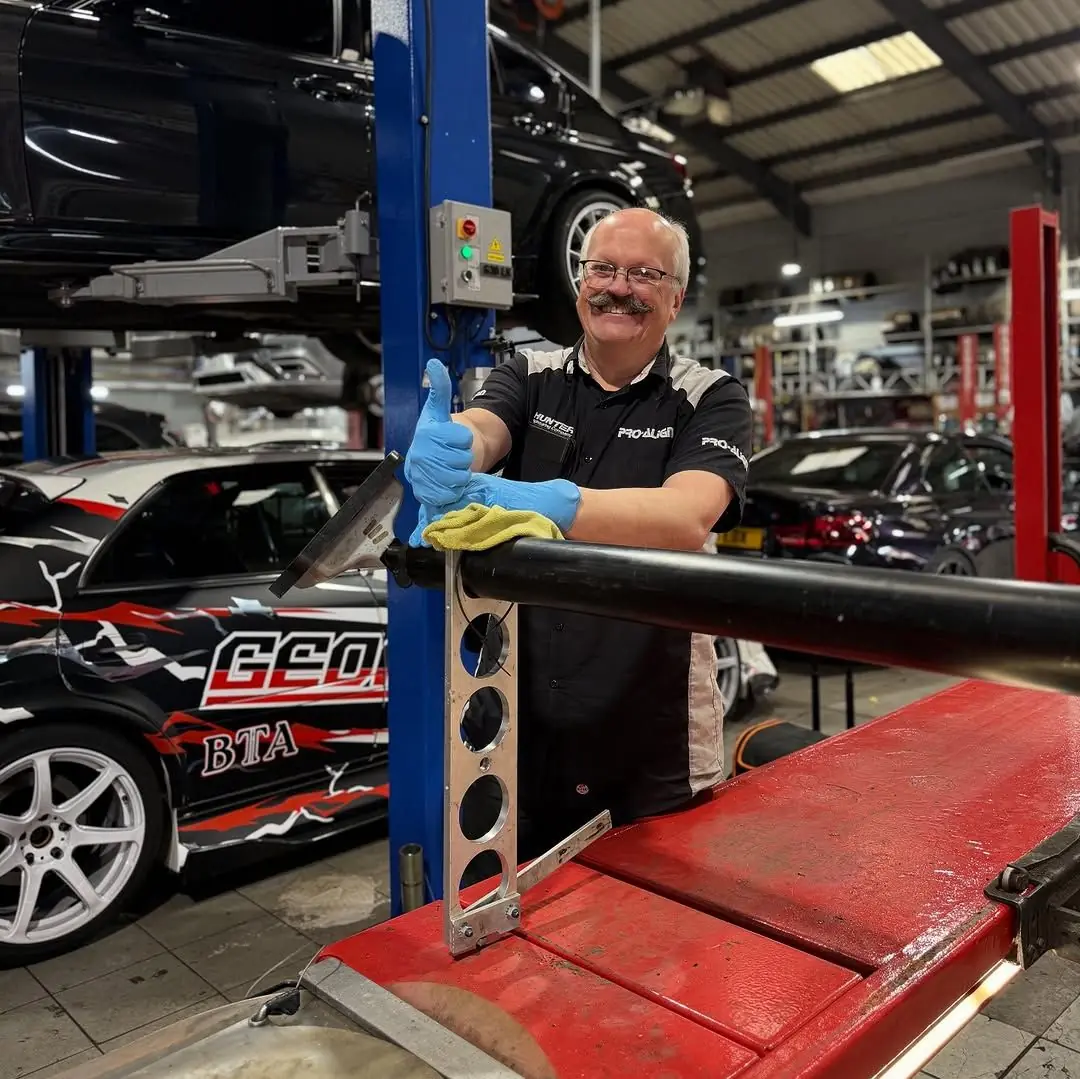 Luke setting a car up on the alignment rig at White Rose Motors