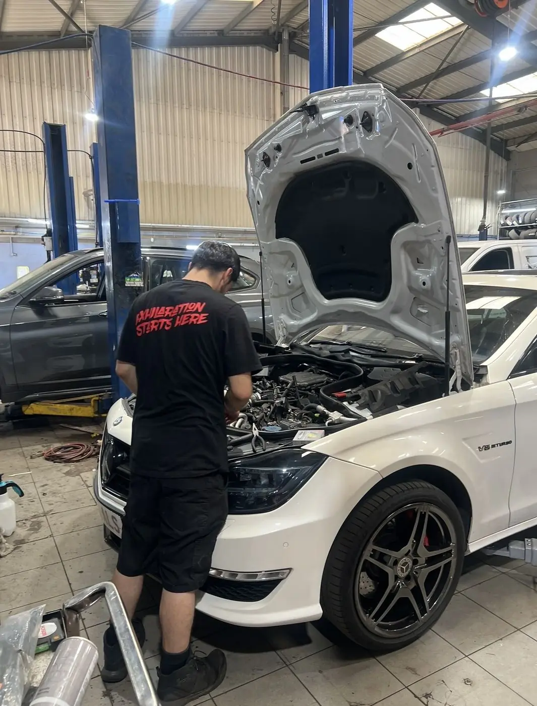 A mechanic reading a fault on a Mercedes-AMG at White Rose Motors